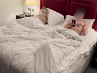 Hotel Room Bed Sharing Leads To Handjob From Blonde Stepmom