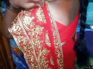 Desi Bhabi switching Her crimson Shari .